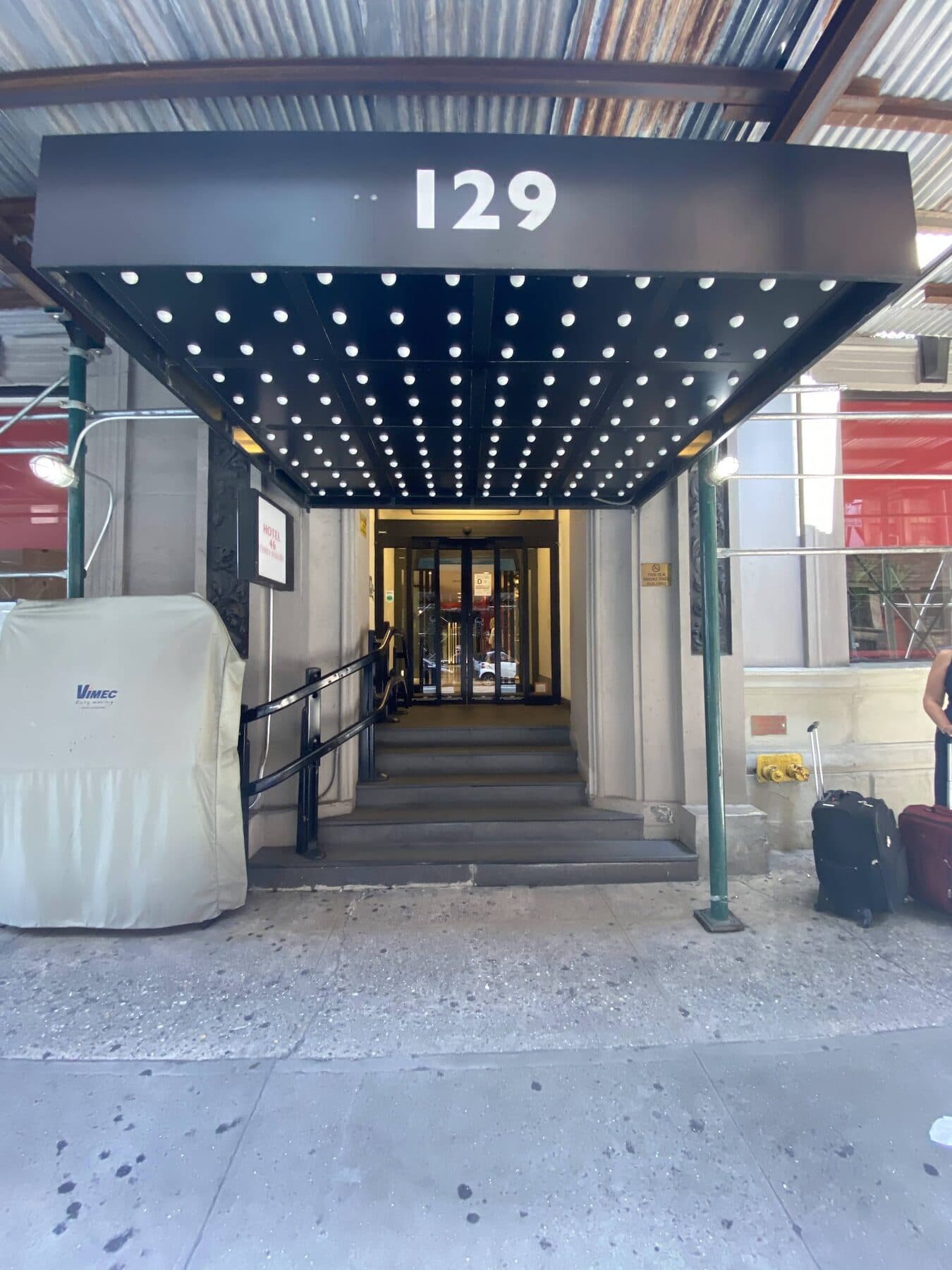 The red 129 awning at the entrance