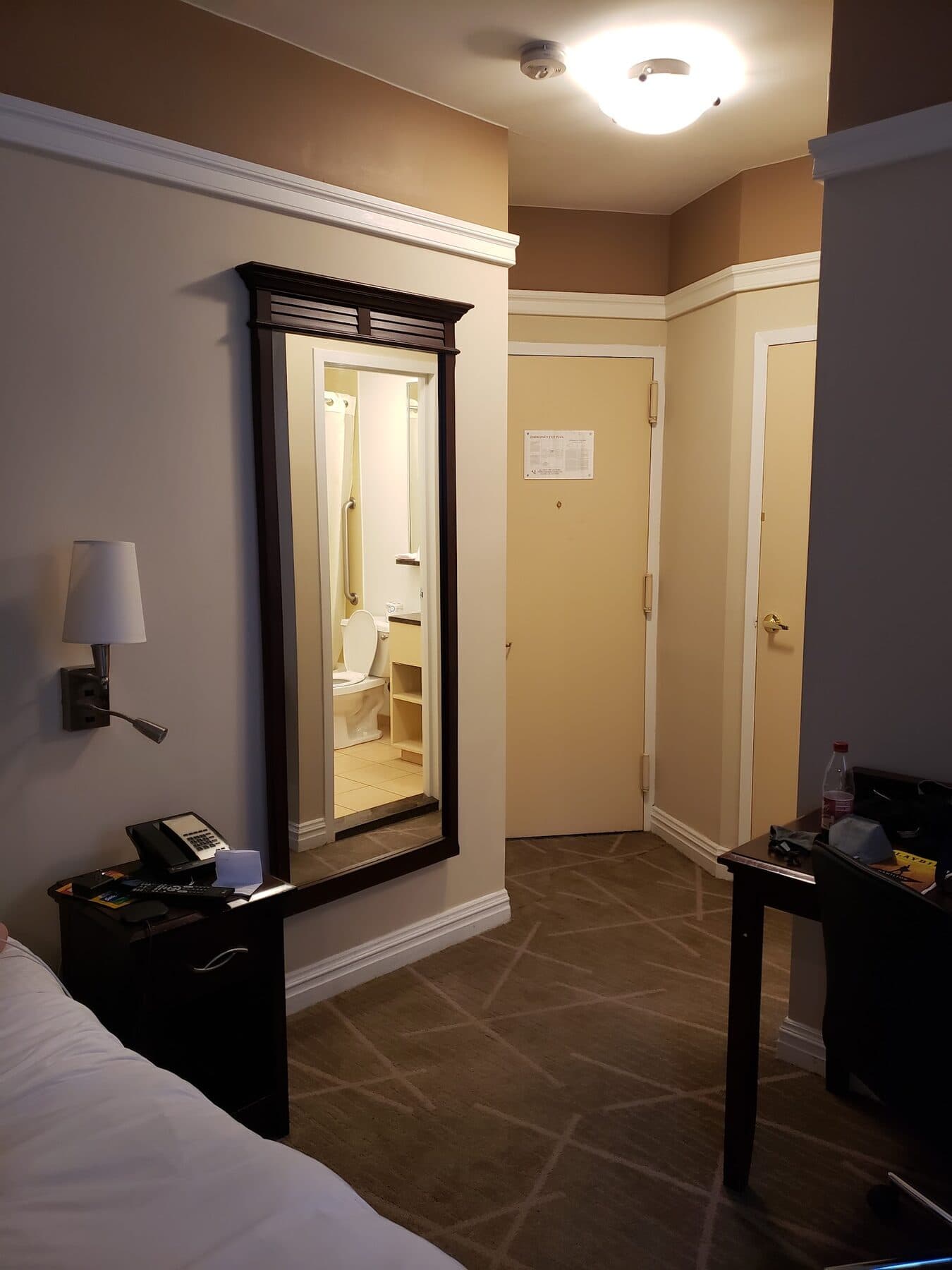 Classic queen room (room 405) at The 46, 129 West 46th Street, Midtown NYC: entry with full-length mirror