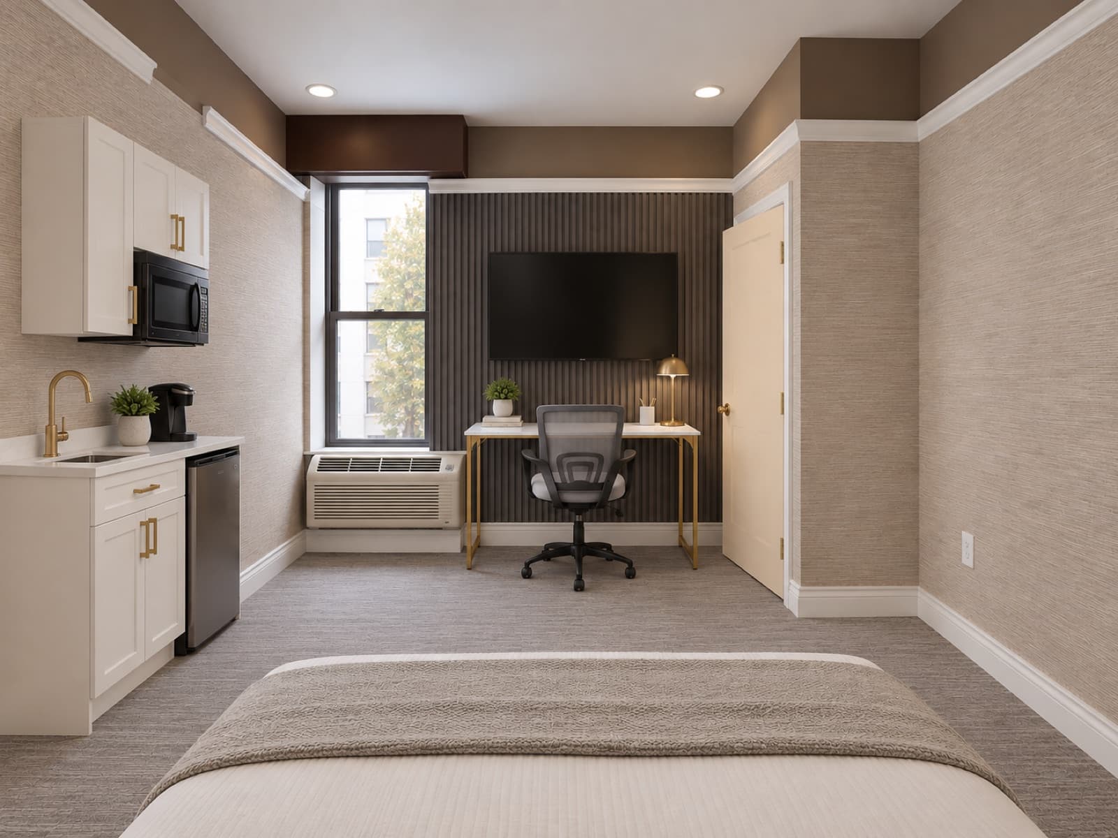 Virtually staged view of the kitchenette area and desk by the window at The 46, 129 West 46th Street, Midtown NYC