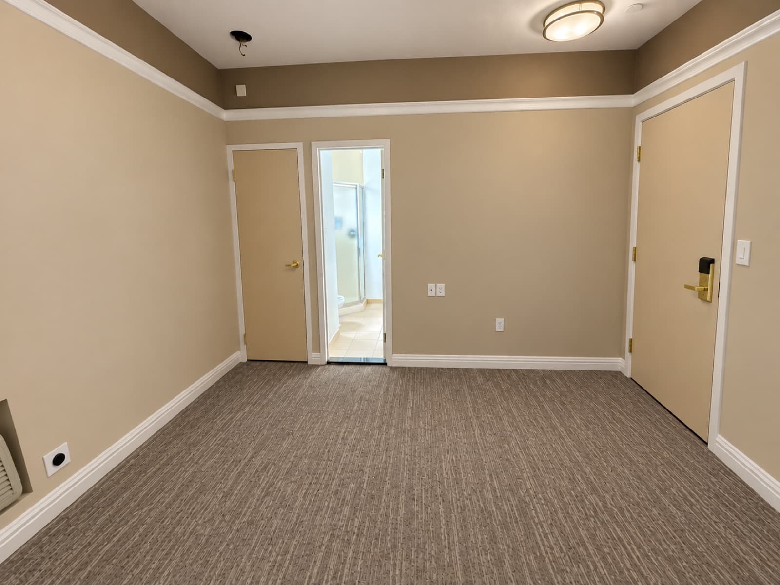 The empty room, looking toward the doors at The 46, 129 West 46th Street, Midtown NYC