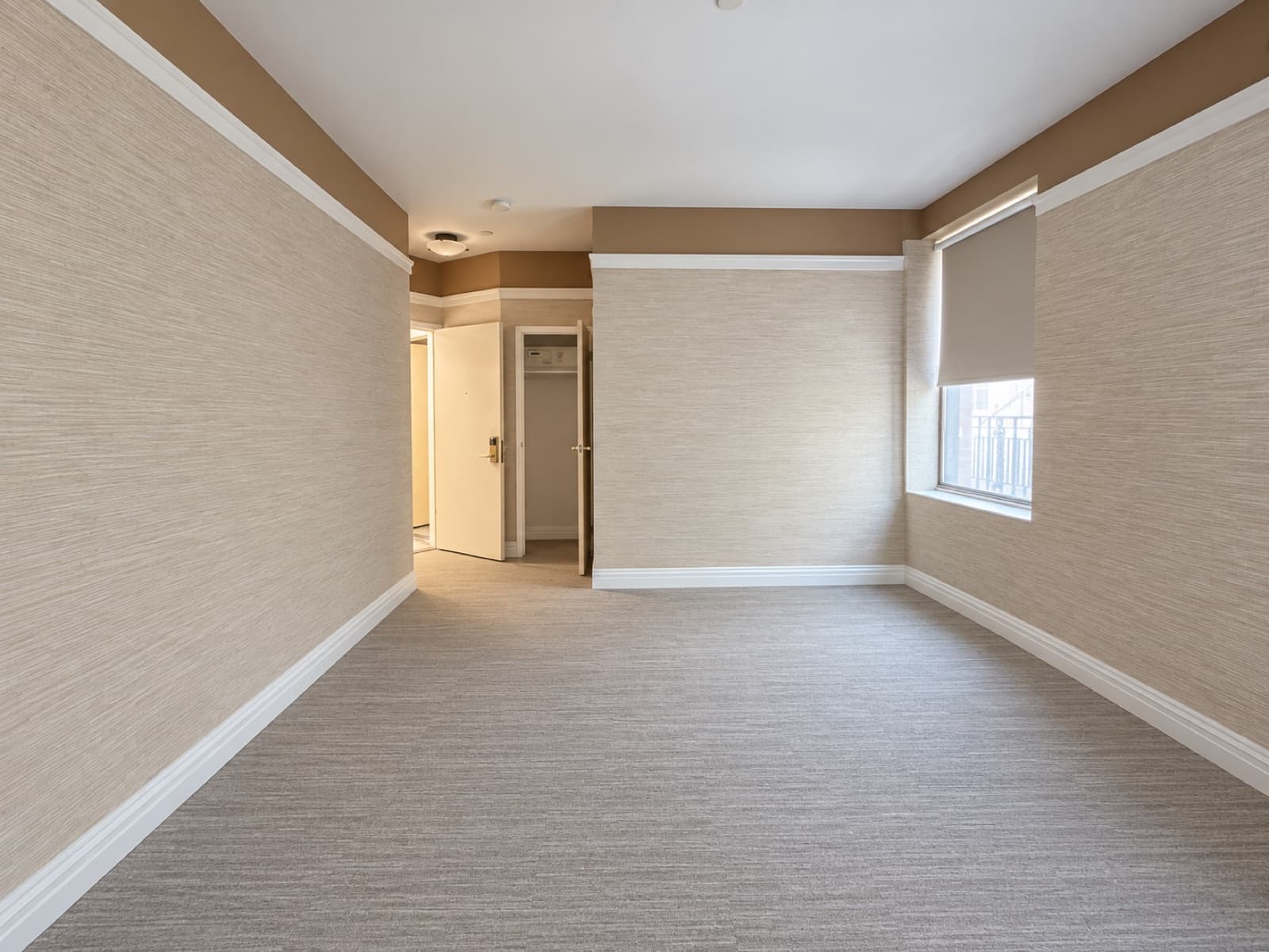 The empty room, looking toward the entry at The 46, 129 West 46th Street, Midtown NYC