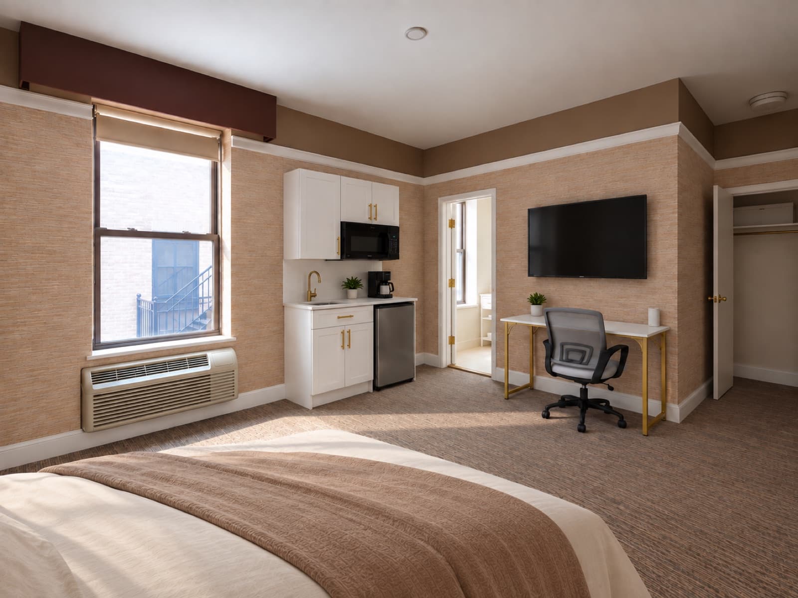 Virtually staged view of the kitchenette area, desk and window at The 46, 129 West 46th Street, Midtown NYC